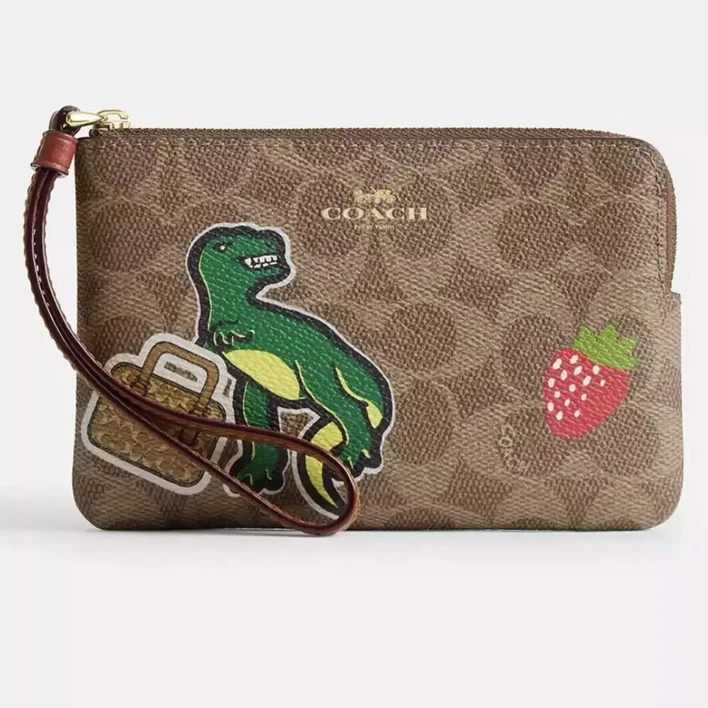 NWT Coach Corner Zip Wristlet In Signature Canvas With Sticker Print Rexy TRex